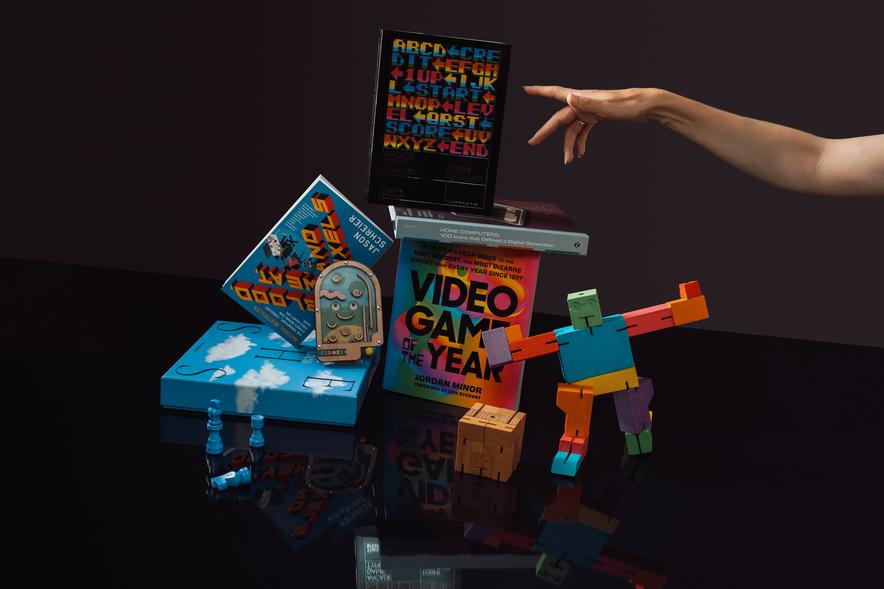 A selection of videogame merchandise stacked on top of each other